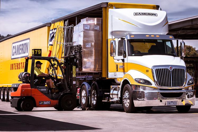 Loaded prime mover and trailer combination illustrating GVM, GCM and payload limits