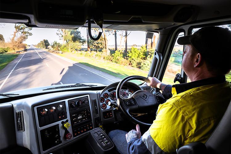 Truck driver on the road, illustrating long-haul truck driver costs